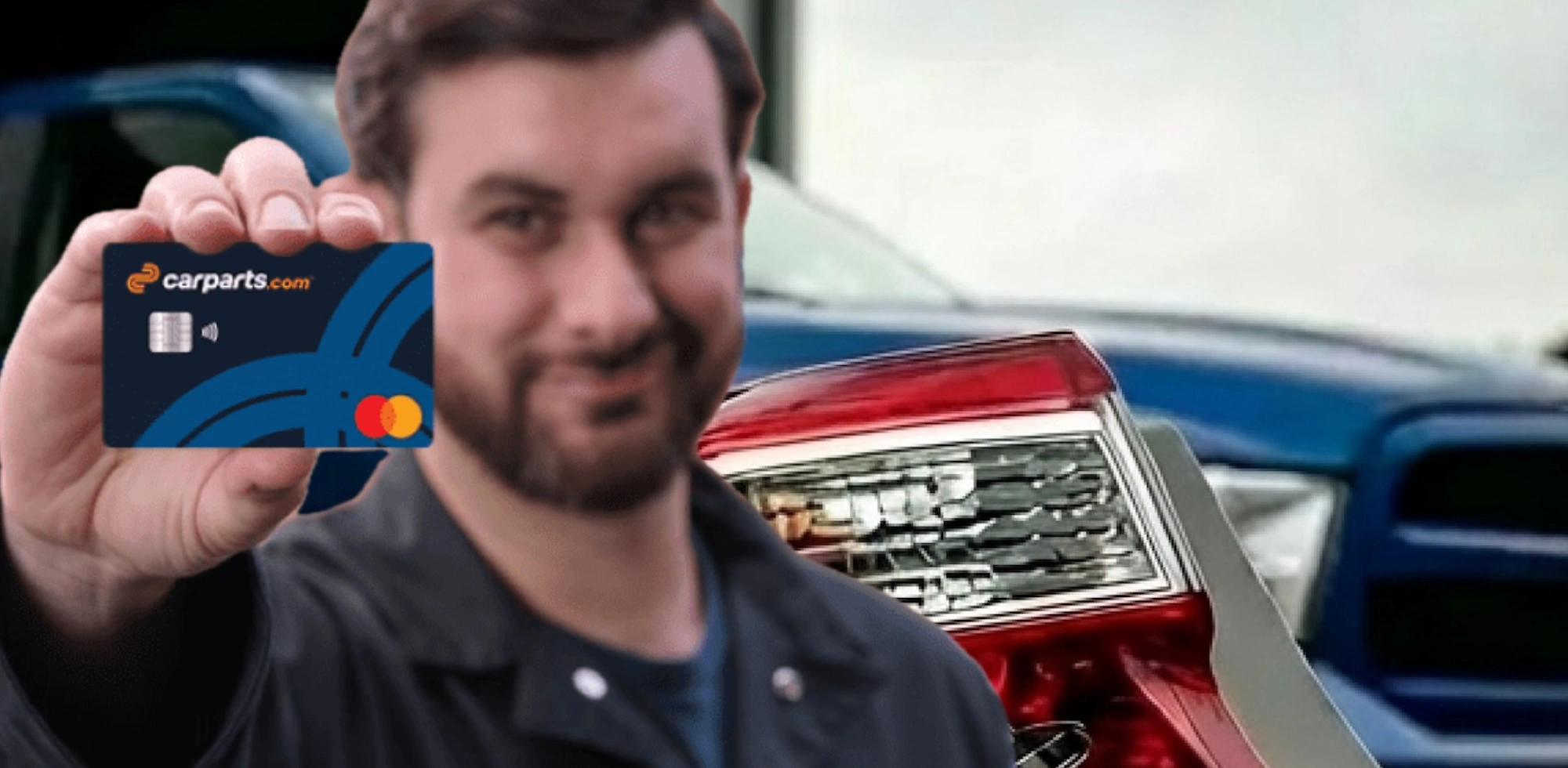 man holding a CarParts.com credit card