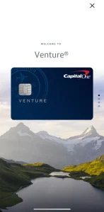 Capital One Venture Card above a mountain lake