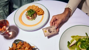 paying for dinner with an AMEX Gold Card