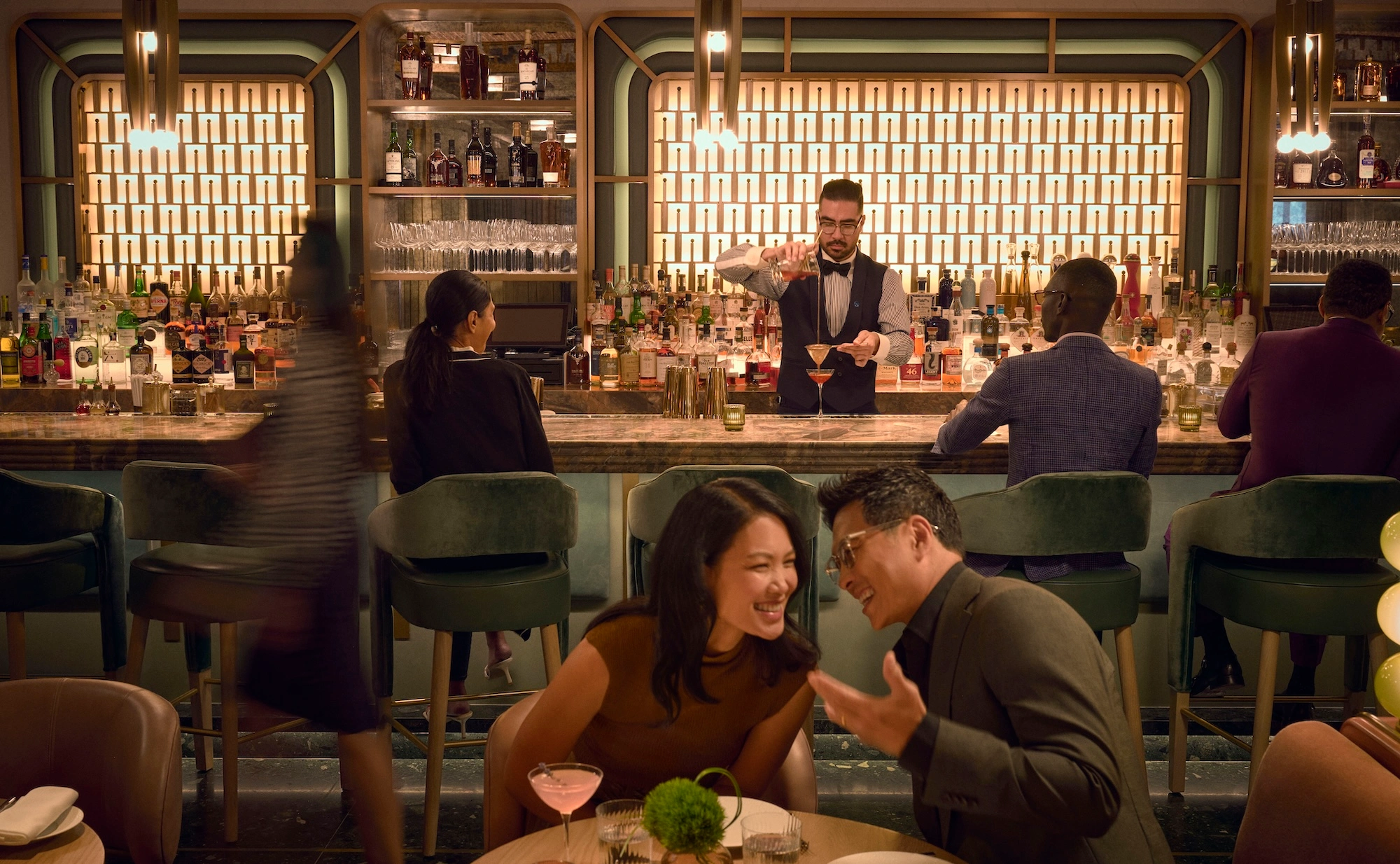 guests at a bar in a Hilton hotel