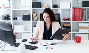 woman working at her home office desk