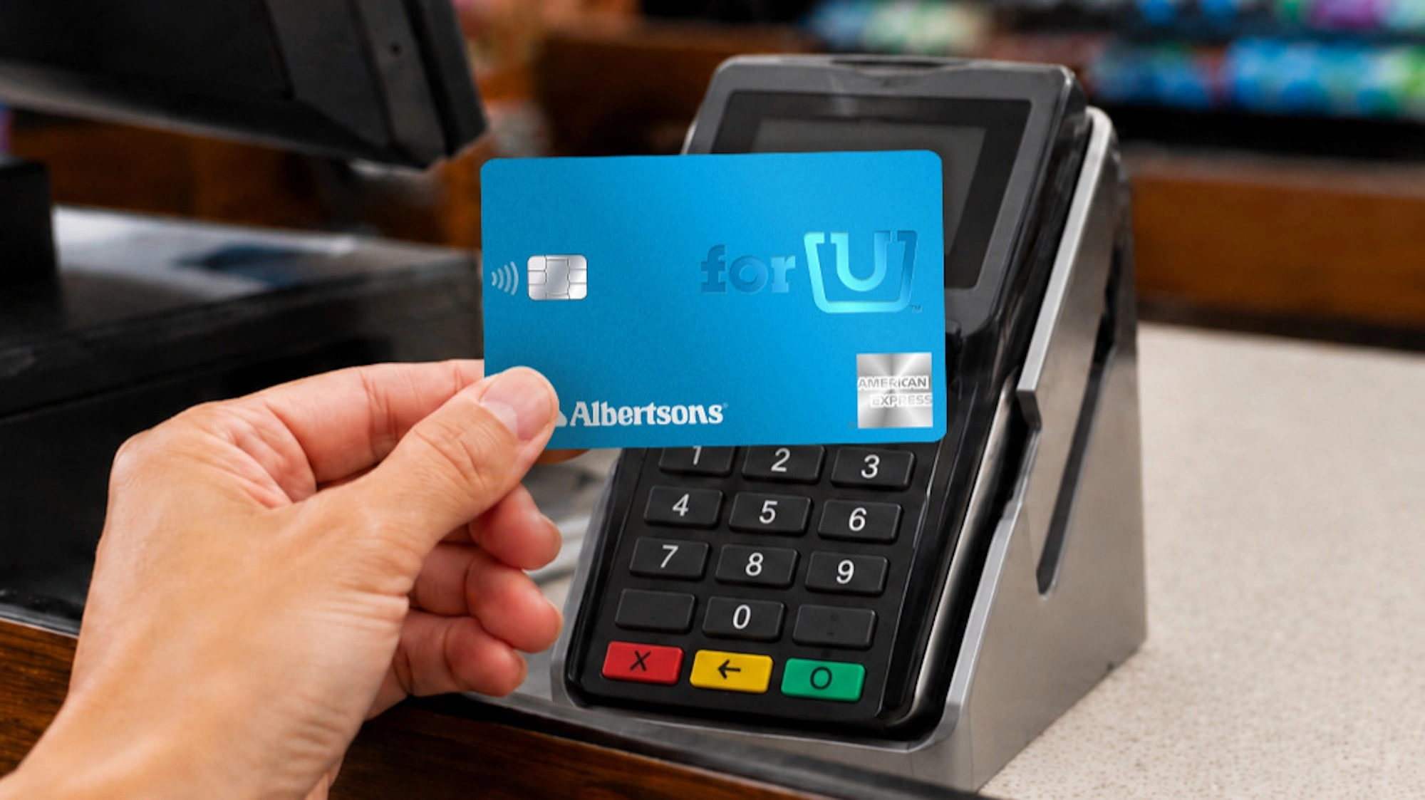 holding an Albertsons credit card