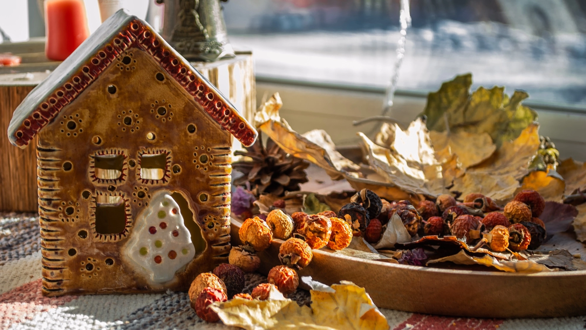 gingerbread house surrounded by a fall potpourri