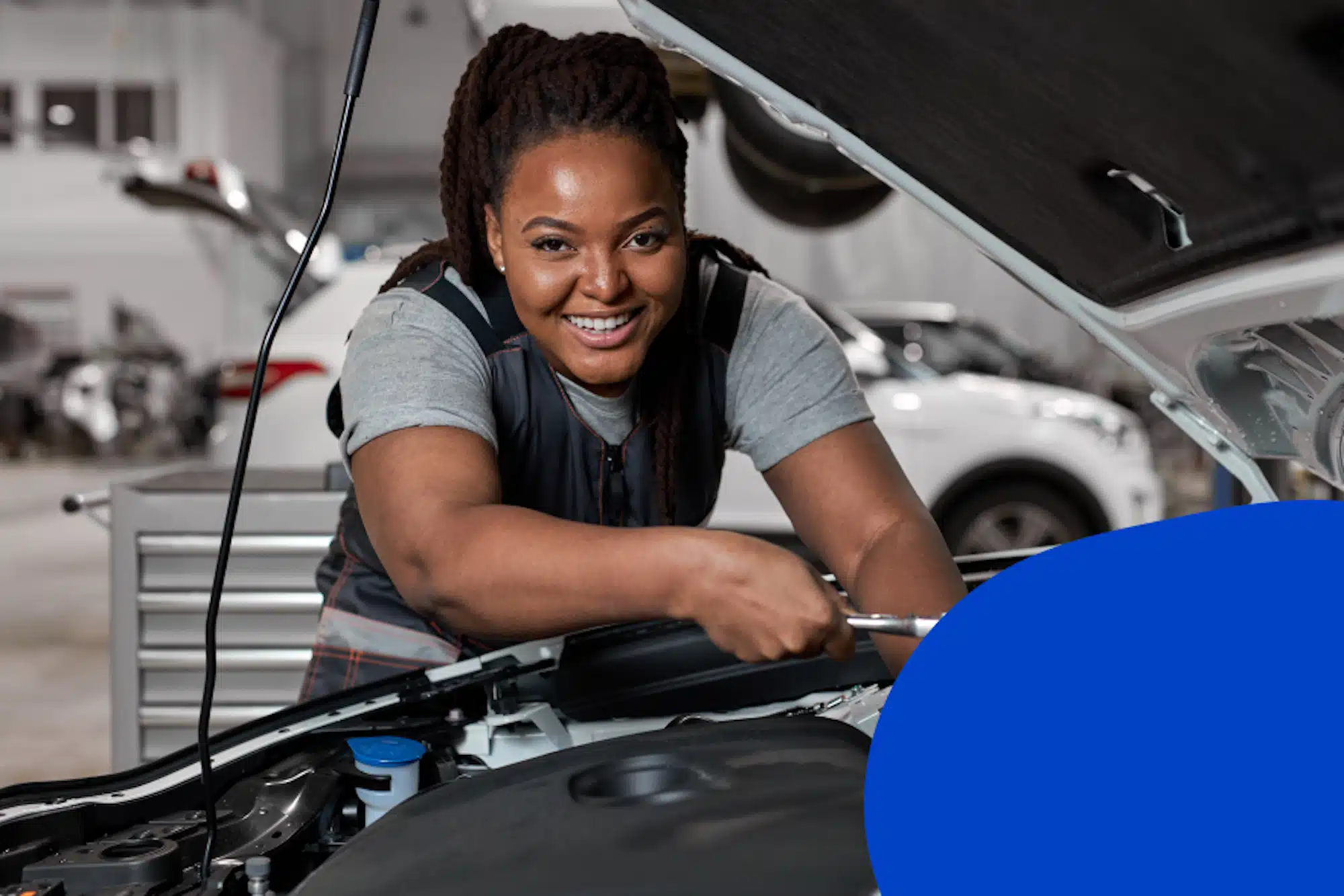woman mechanic working on a car