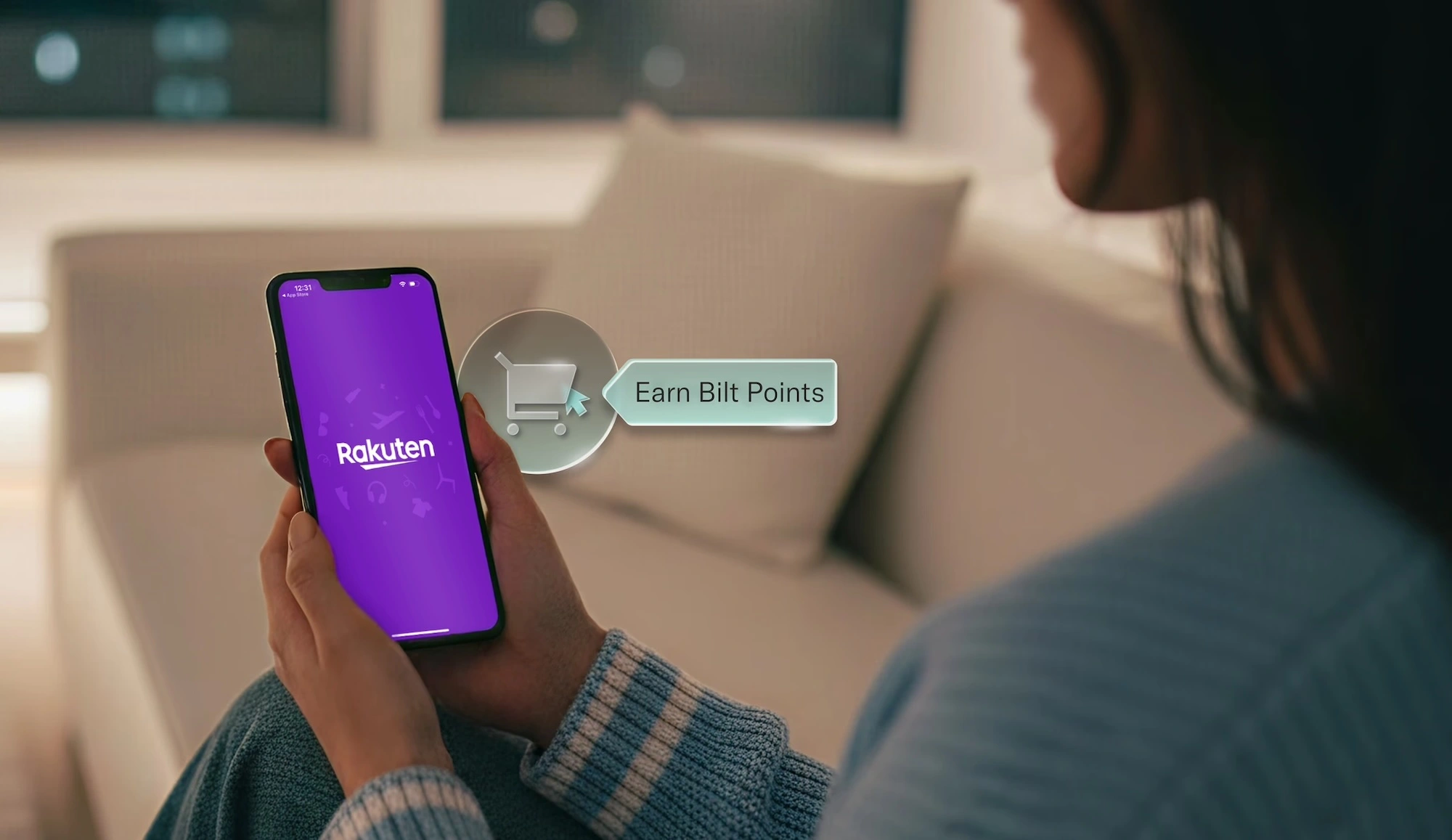 woman holding a cell phone with the Rakuten app and Earn Bilt Points callout